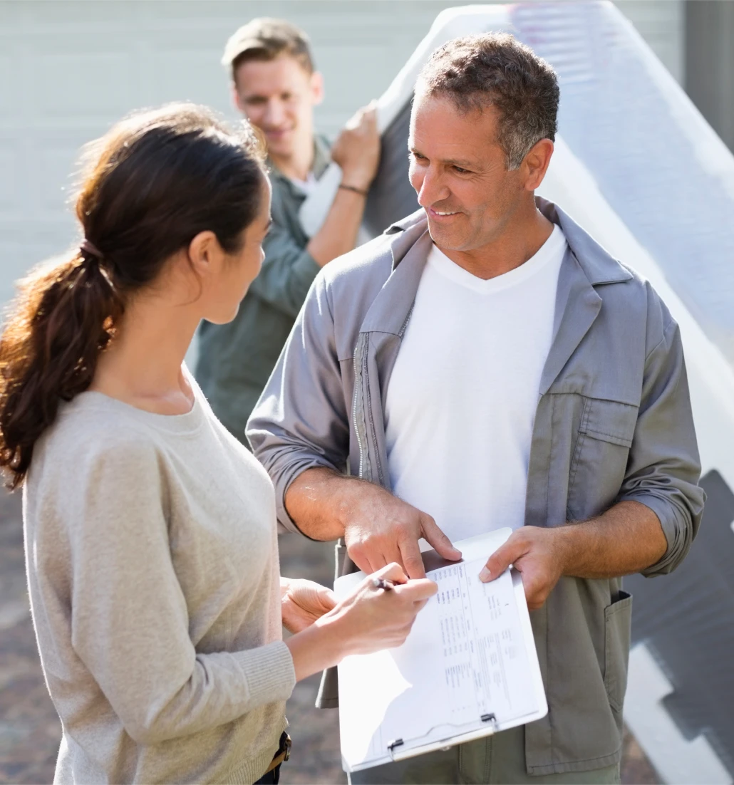 Workers with clipboard discussing outdoors