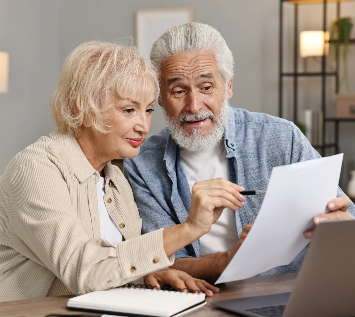 Senior couple discussing paperwork